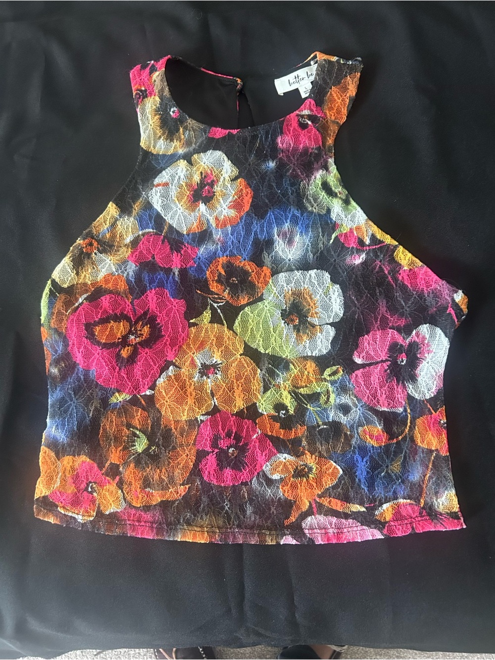 Better Be brand sleeveless floral lace crop top in black.
